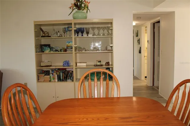 a view of a livingroom with furniture window and wooden floor