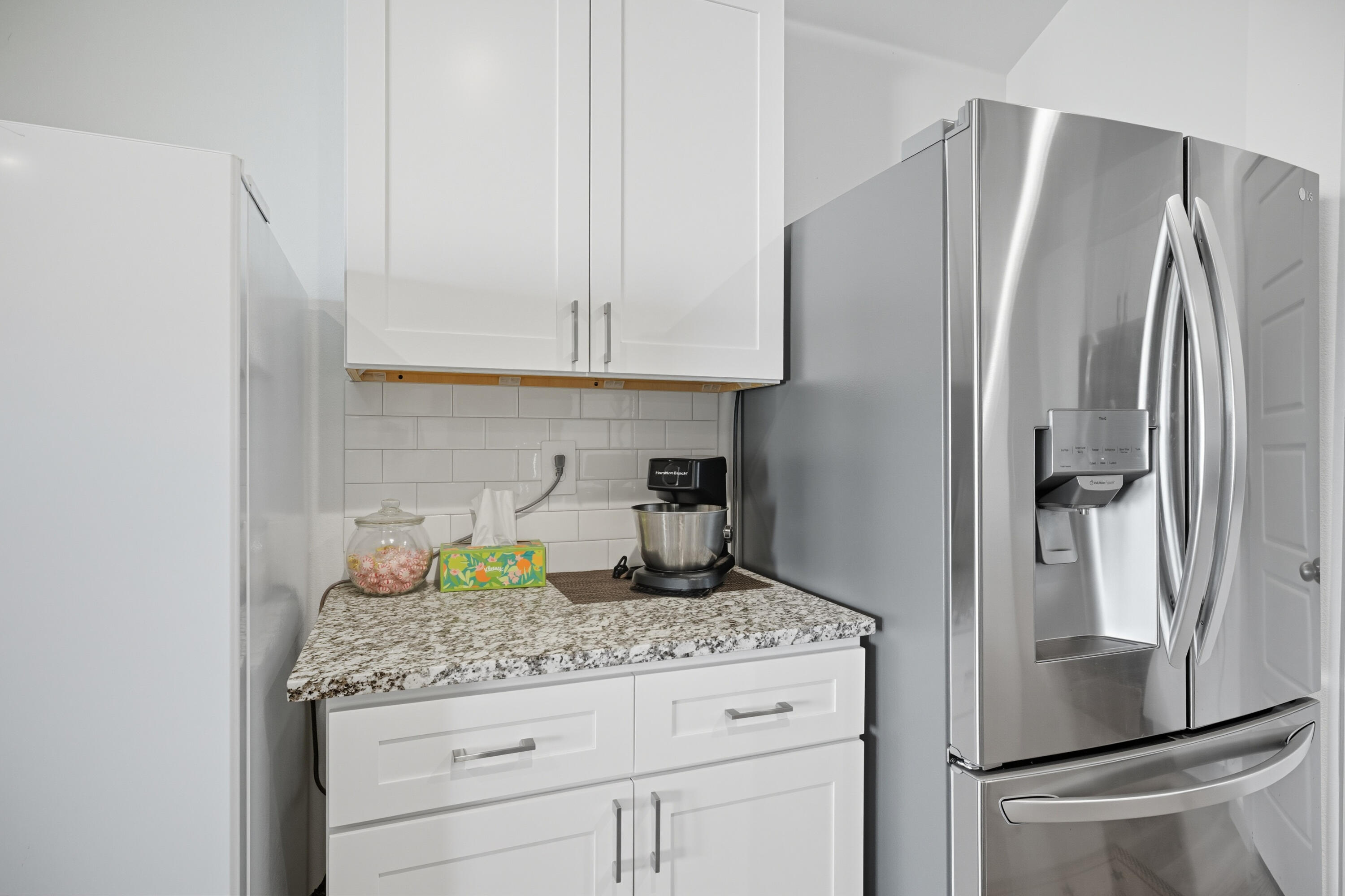 2902 133rd Street Lubbock, TX 79423 - Photo 11 of 38 a kitchen with granite countertop a refrigerator sink and cabinets