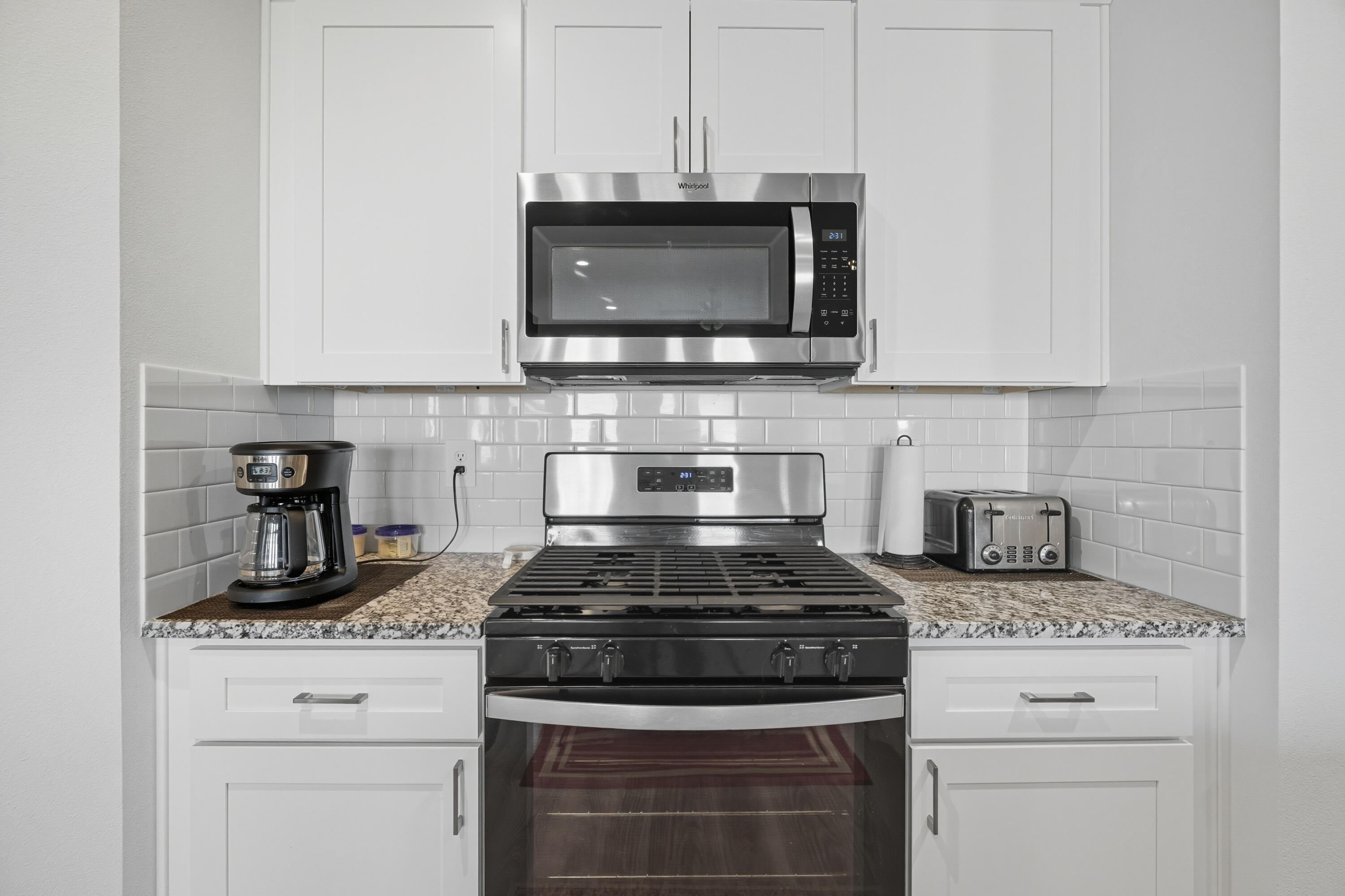 2902 133rd Street Lubbock, TX 79423 - Photo 13 of 38 a stove top oven sitting inside of a kitchen
