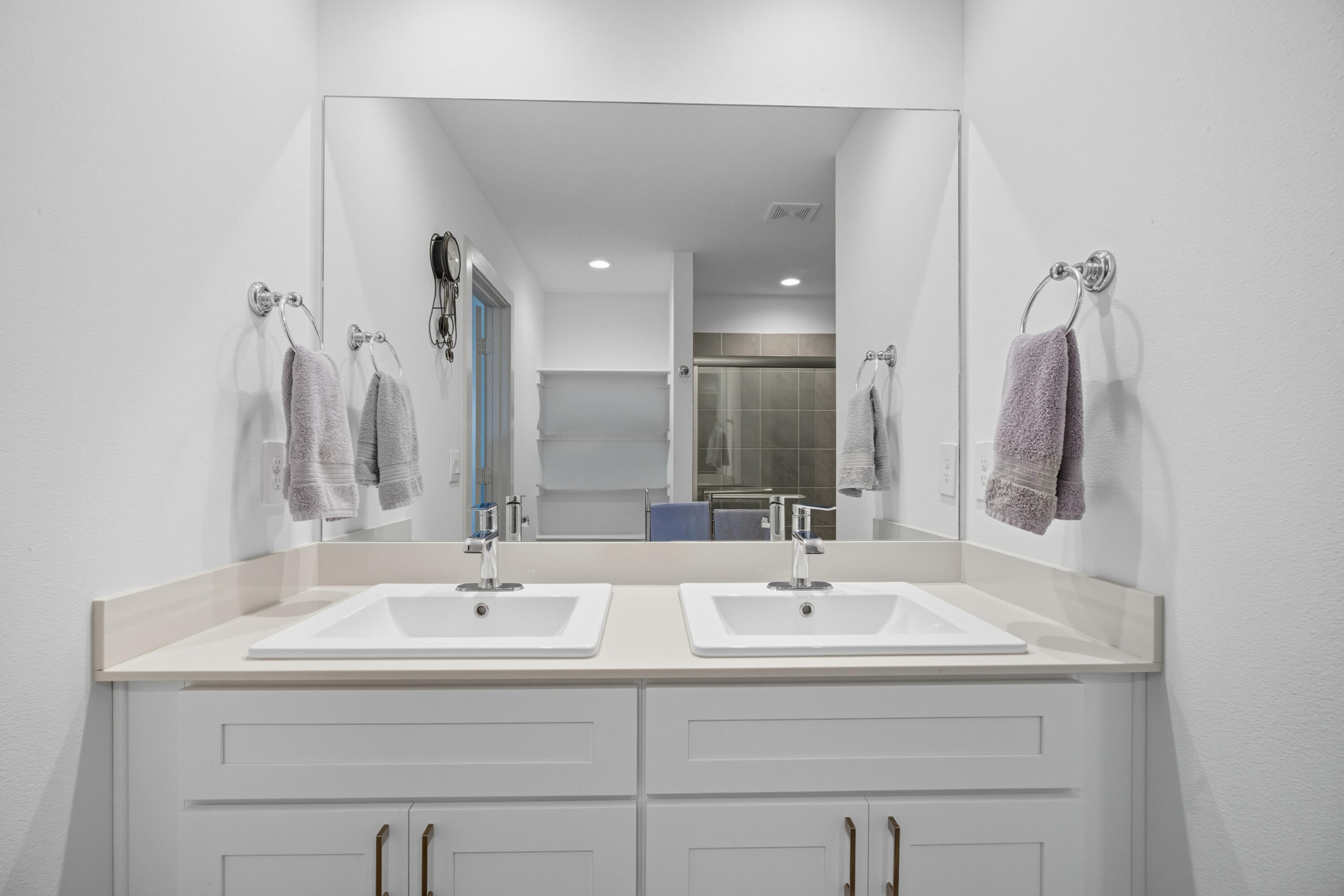 2902 133rd Street Lubbock, TX 79423 - Photo 21 of 38 a bathroom with a sink and a mirror