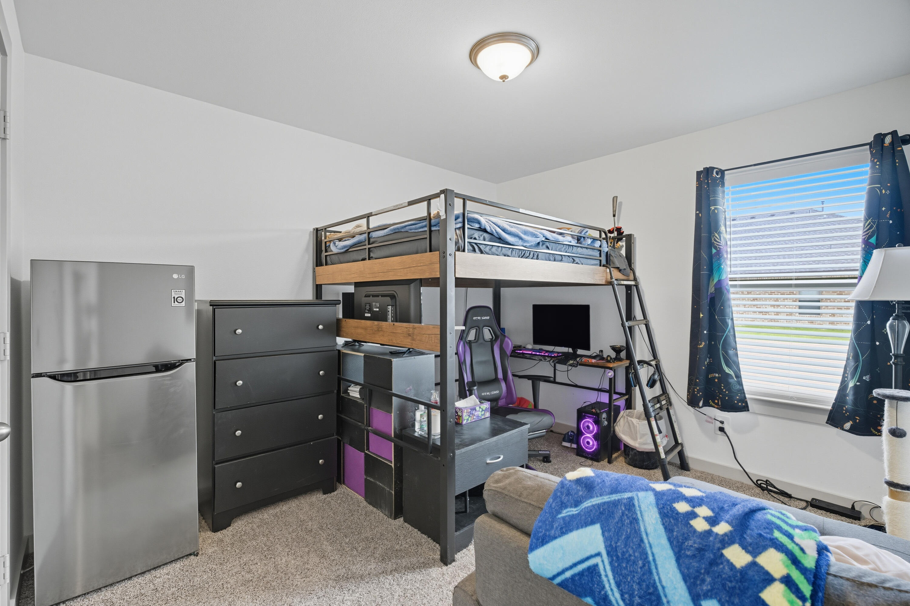 2902 133rd Street Lubbock, TX 79423 - Photo 27 of 38 a storage room with furniture and a flat screen tv