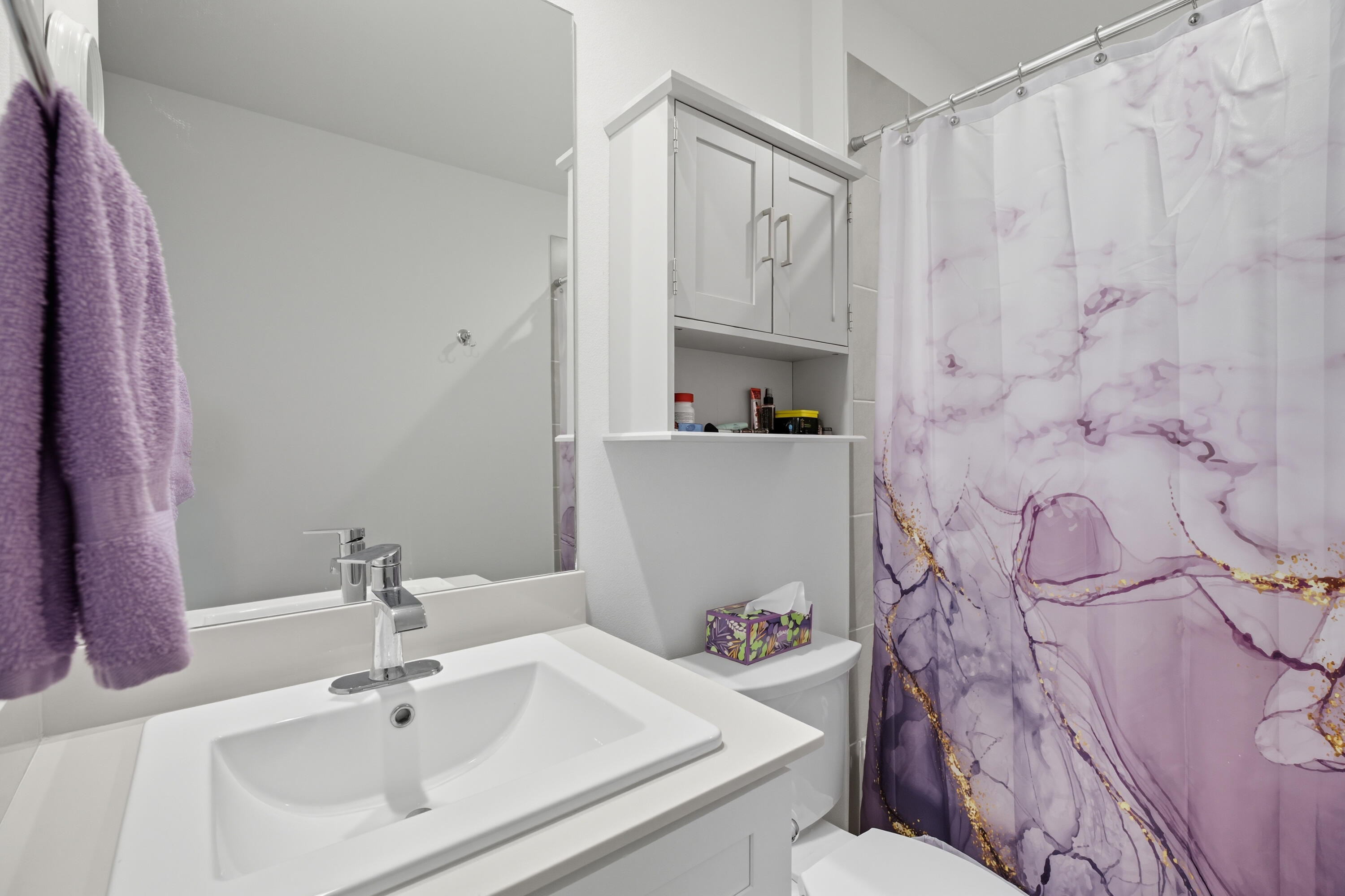 2902 133rd Street Lubbock, TX 79423 - Photo 32 of 38 a bathroom with a sink toilet and shower