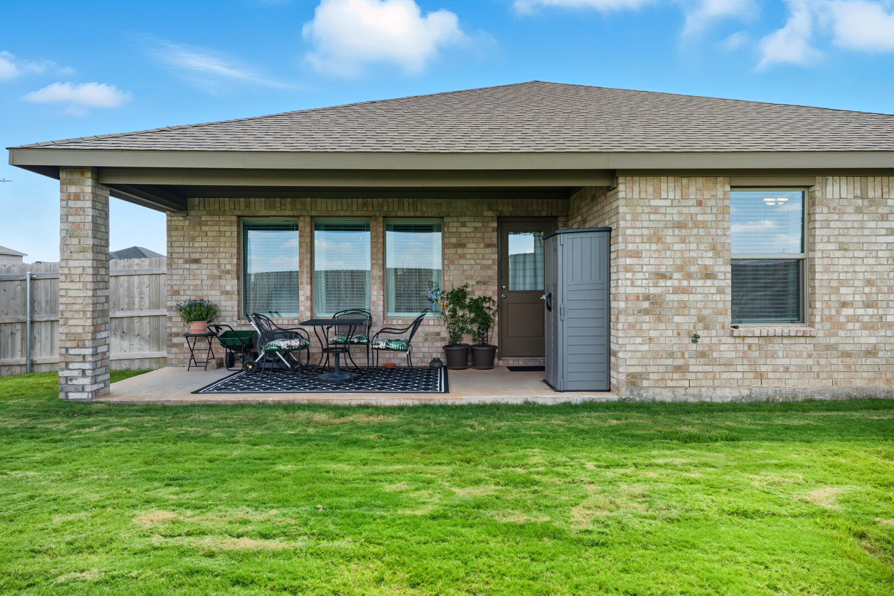 2902 133rd Street Lubbock, TX 79423 - Photo 34 of 38 a view of a house with patio and a yard