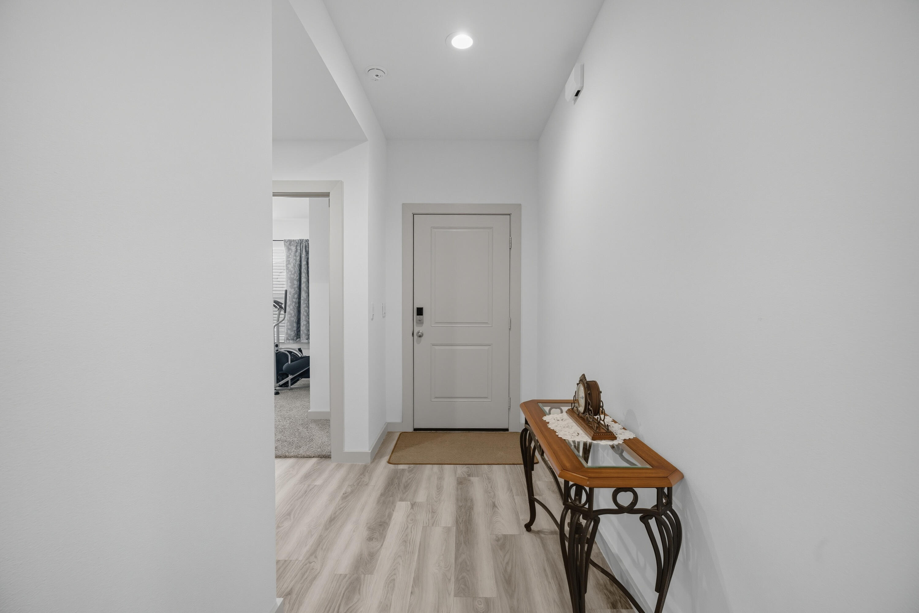 2902 133rd Street Lubbock, TX 79423 - Photo 4 of 38 a view of a hallway with wooden floor and a bathroom
