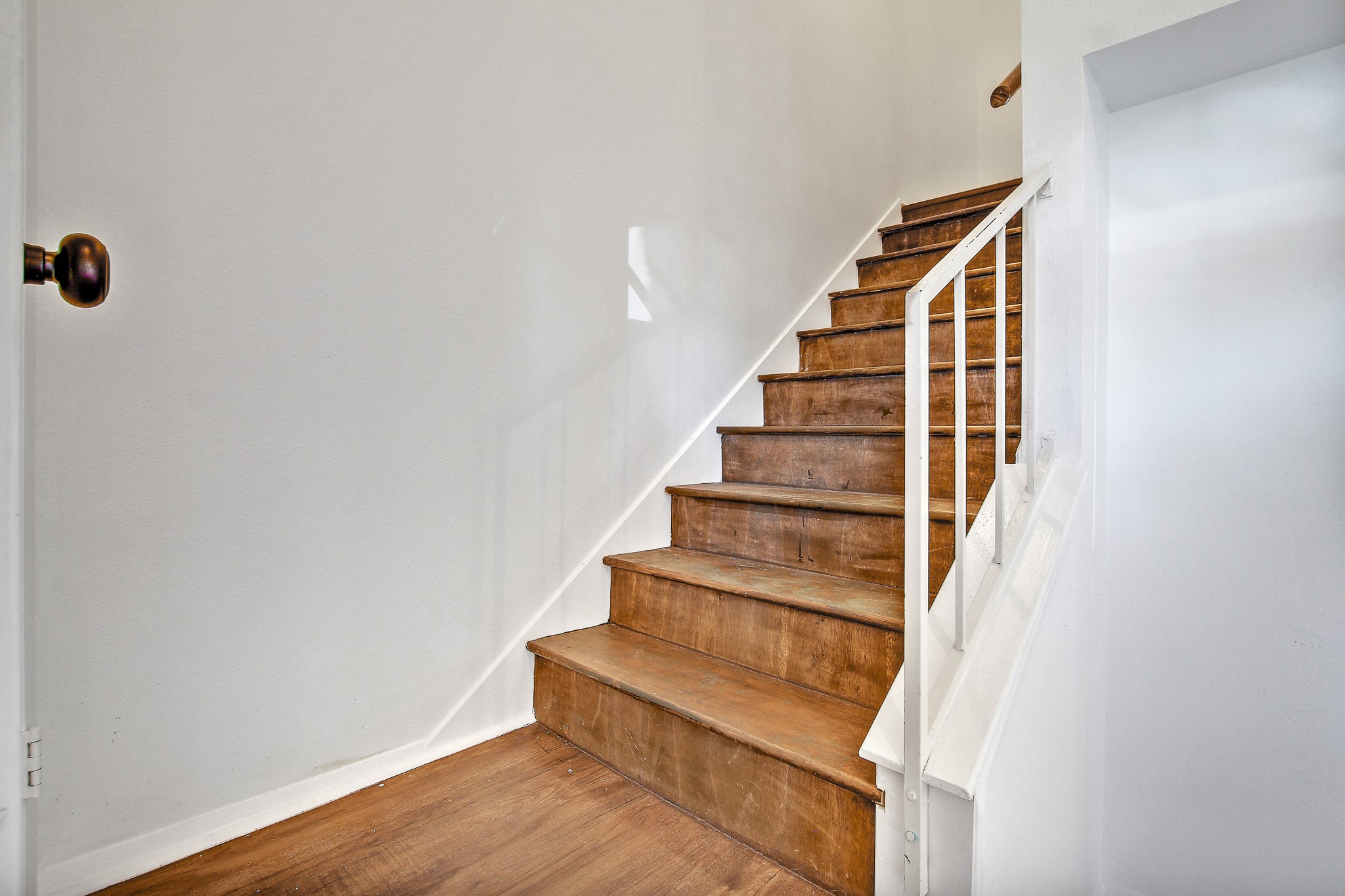 8925 North Plaza, Unit 69 Austin, TX 78753 - Photo 18 of 29 Stairway with wood finished floors and baseboards