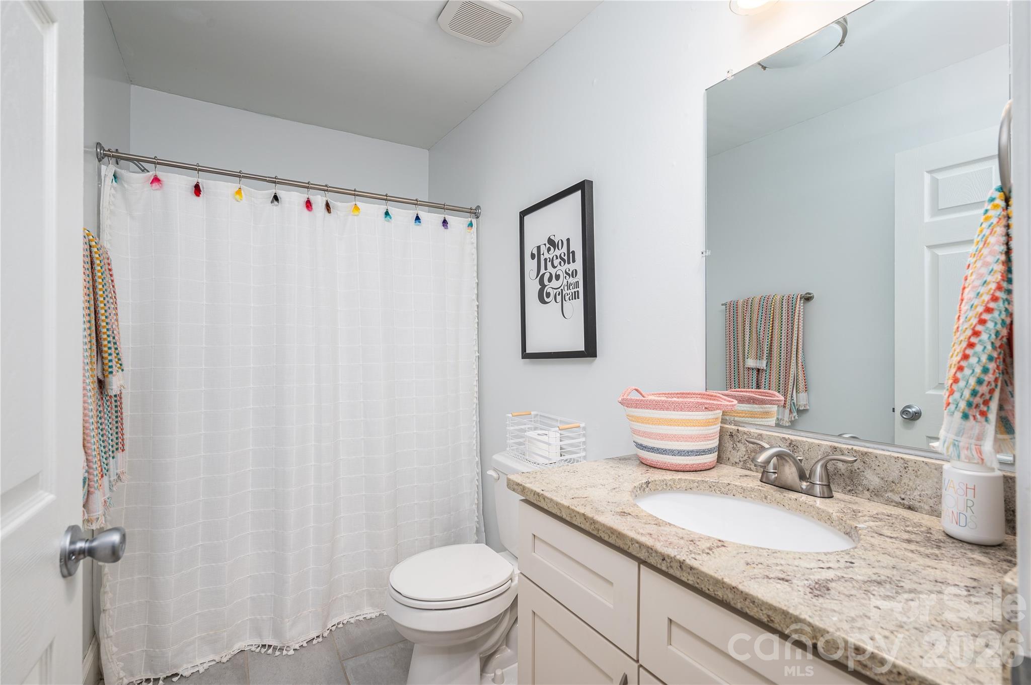 58 Fourth Street Cramerton, NC 28032 - Photo 27 of 44 a bathroom with a granite countertop sink and a mirror