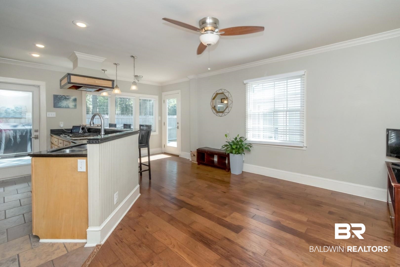 116 Florence Place Mobile, AL 36607 - Photo 14 of 41 Kitchen with a healthy amount of sunlight, wood-type flooring, and hanging light fixtures
