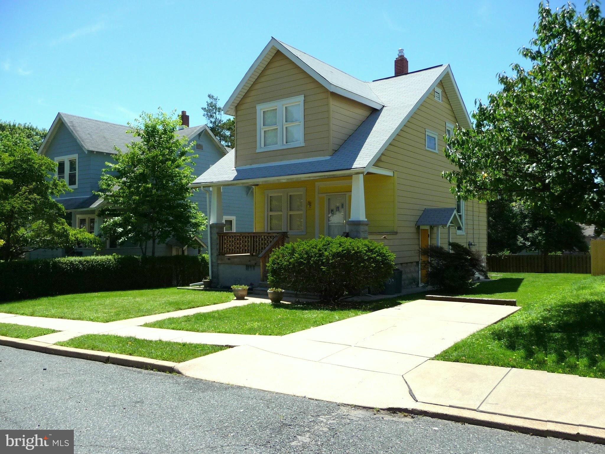409 Walcott Road Baltimore, MD 21206 - Photo 1 of 27 a front view of a house with yard