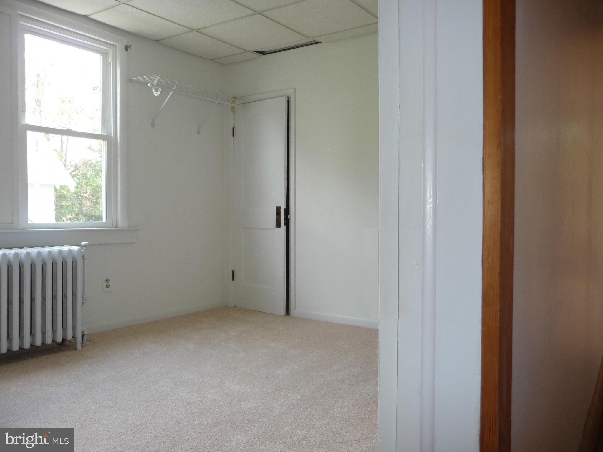 409 Walcott Road Baltimore, MD 21206 - Photo 16 of 27 a view of an empty room with a window
