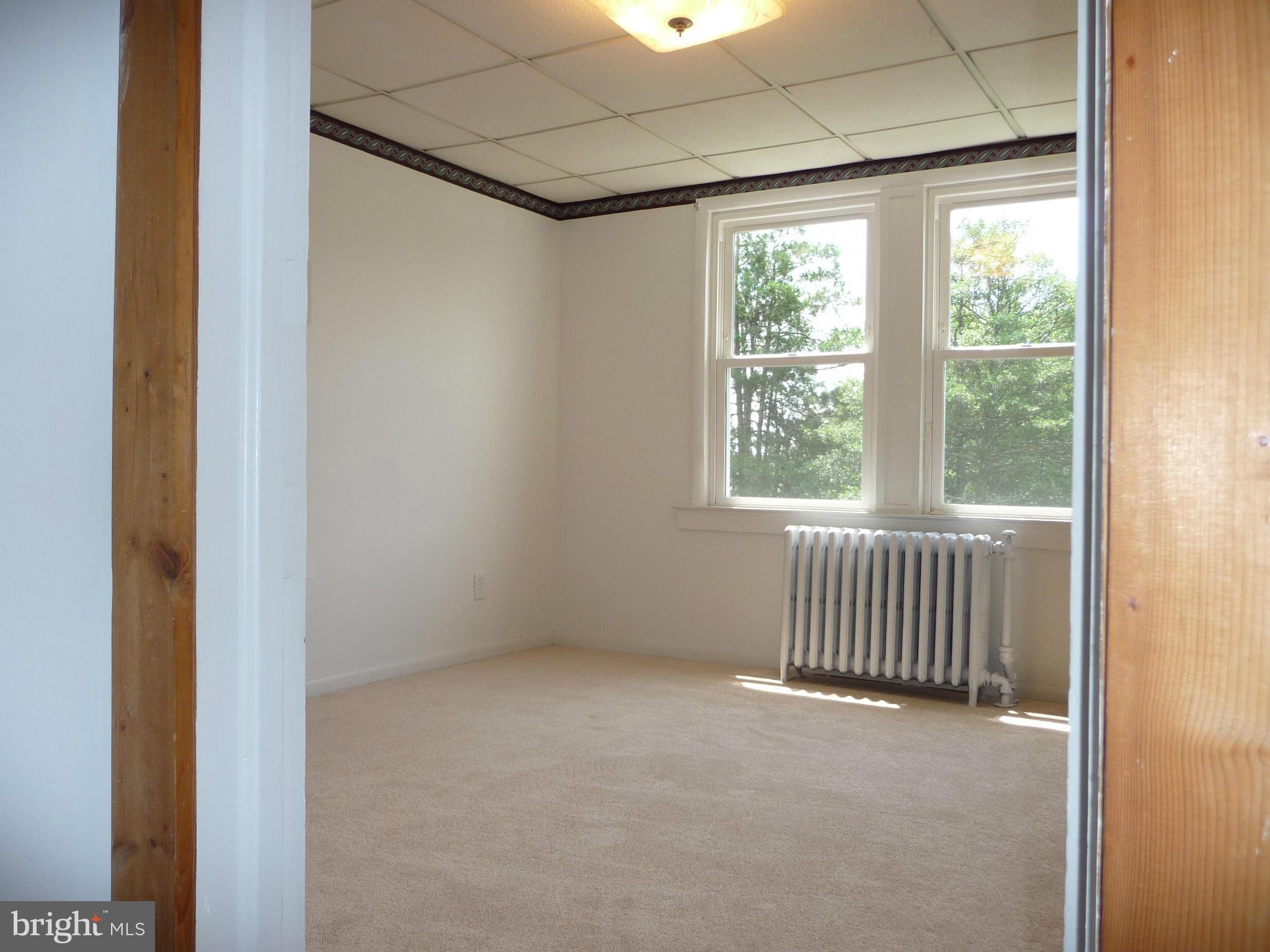 409 Walcott Road Baltimore, MD 21206 - Photo 19 of 27 a view of an empty room with a window