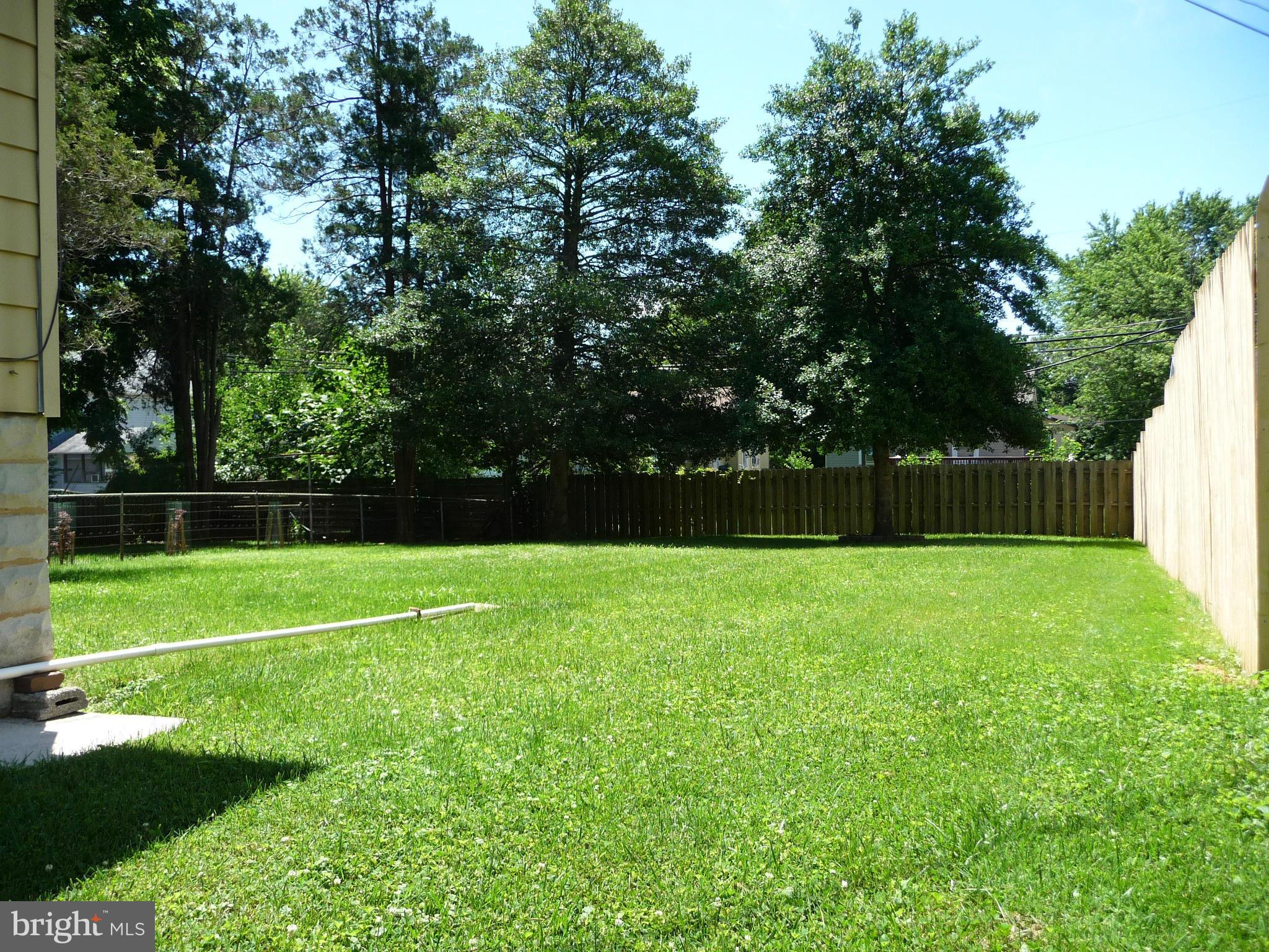 409 Walcott Road Baltimore, MD 21206 - Photo 27 of 27 a view of a field of grass and trees