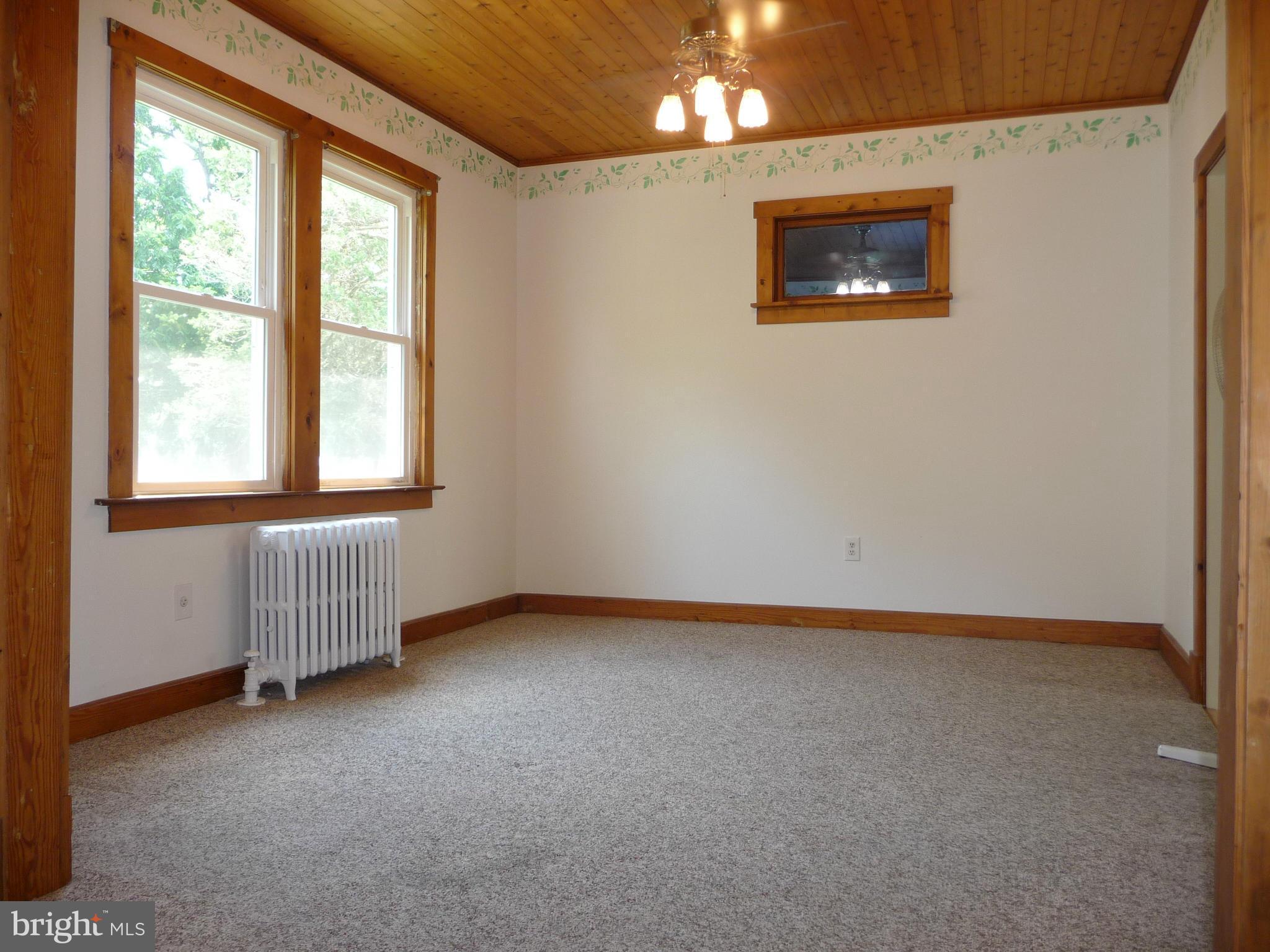 409 Walcott Road Baltimore, MD 21206 - Photo 5 of 27 an empty room with windows