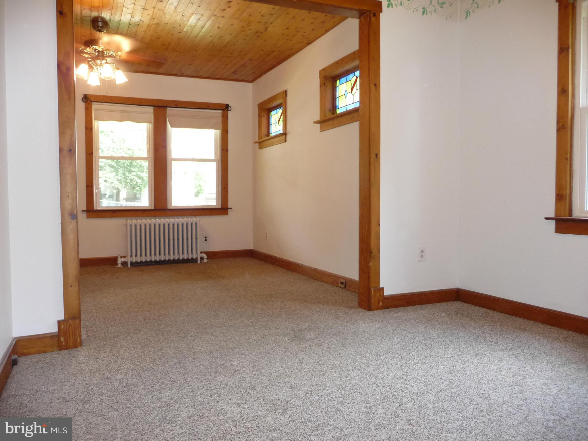 409 Walcott Road Baltimore, MD 21206 - Photo 6 of 27 an empty room with windows