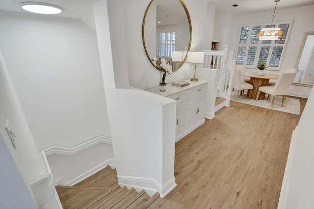 a bathroom with a granite countertop toilet a sink and mirror