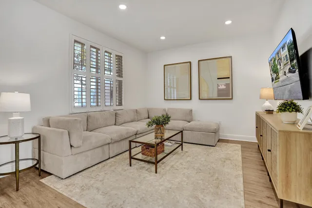 a living room with furniture and windows