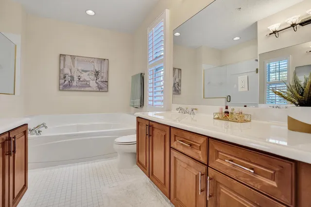 a view of walk in closet with clothes