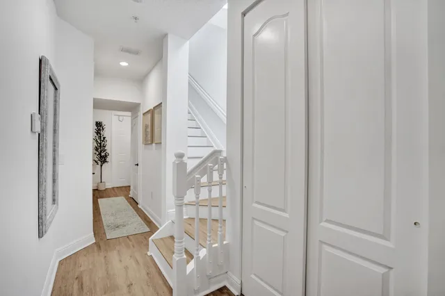 a living room with furniture and a ceiling fan