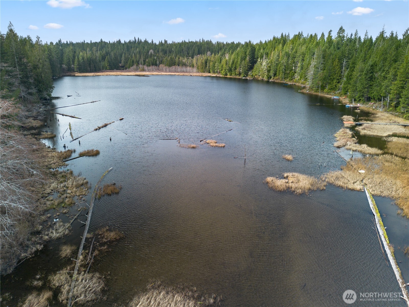 905 Northeast Tahuya Blacksmith Road Tahuya, WA 98588 - Photo 21 of 22 an aerial view of a house with a yard and lake view