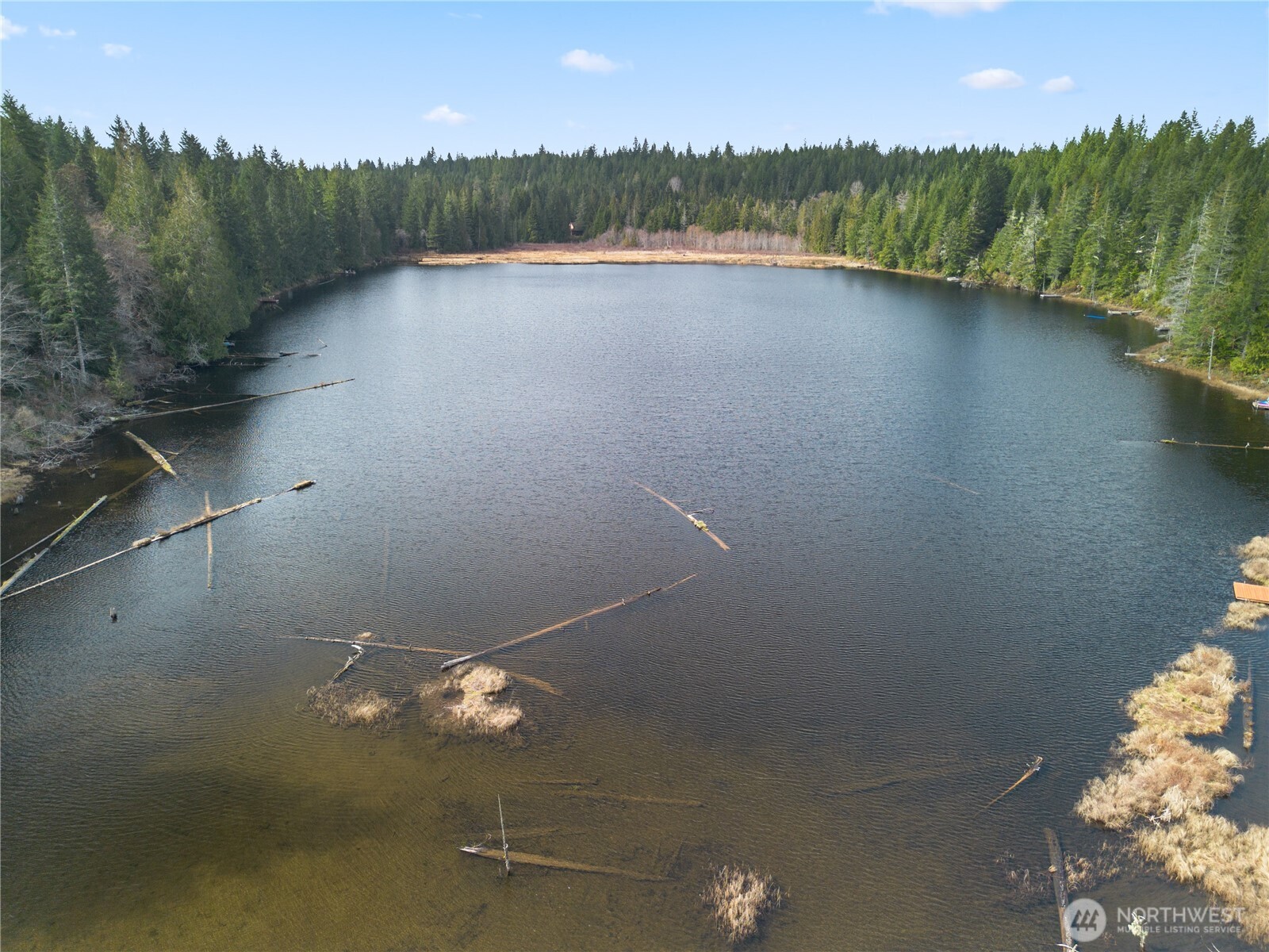 905 Northeast Tahuya Blacksmith Road Tahuya, WA 98588 - Photo 22 of 22 a view of a lake in middle of a house
