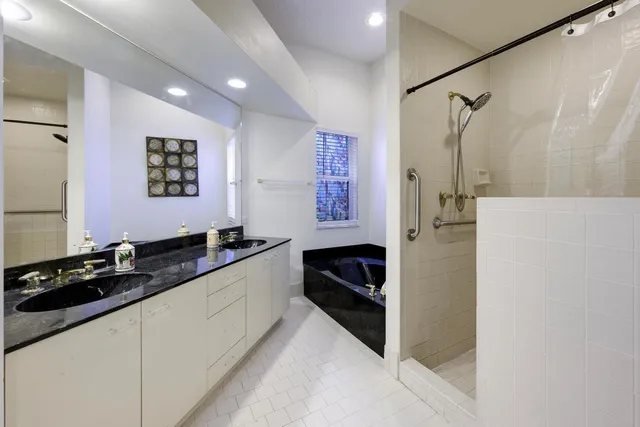 a kitchen with granite countertop a refrigerator and a stove