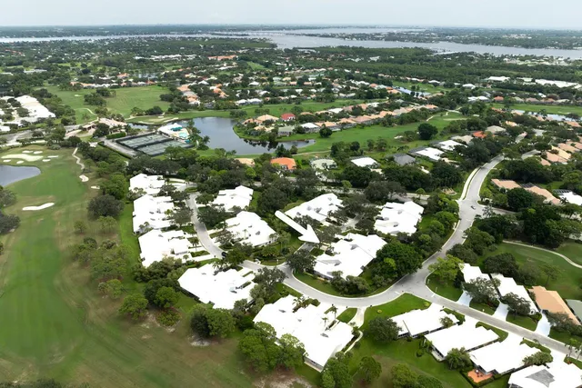 an aerial view of a house with yard