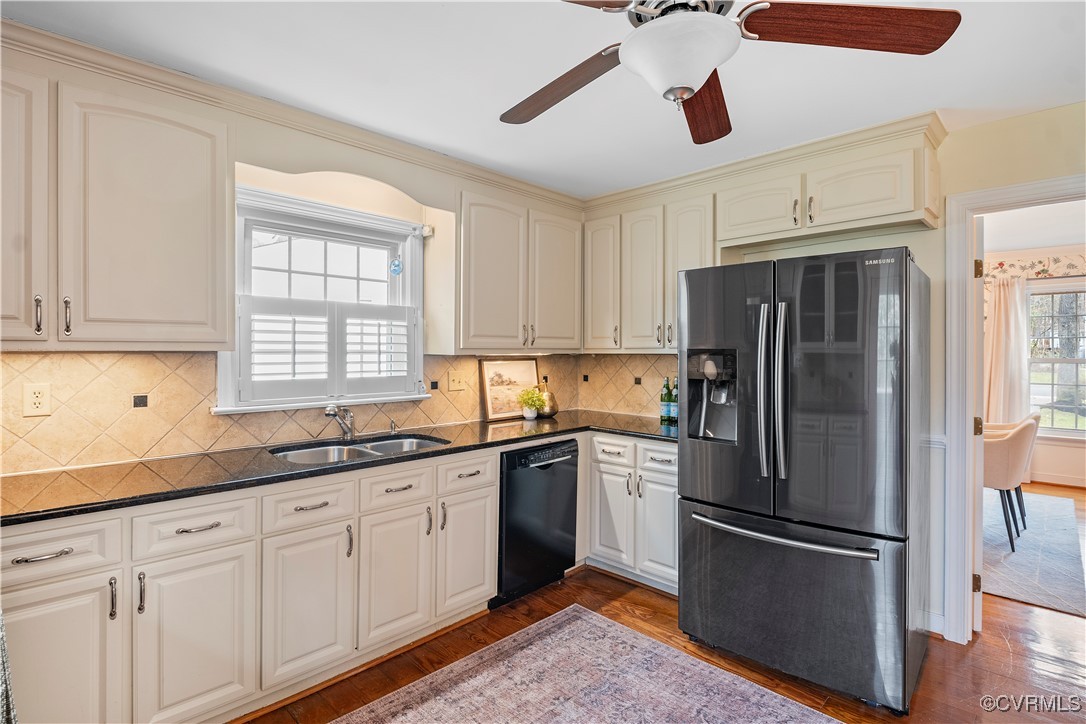 2208 Persimmon Trek Henrico, VA 23233 - Photo 13 of 44 a kitchen with stainless steel appliances a refrigerator sink and cabinets
