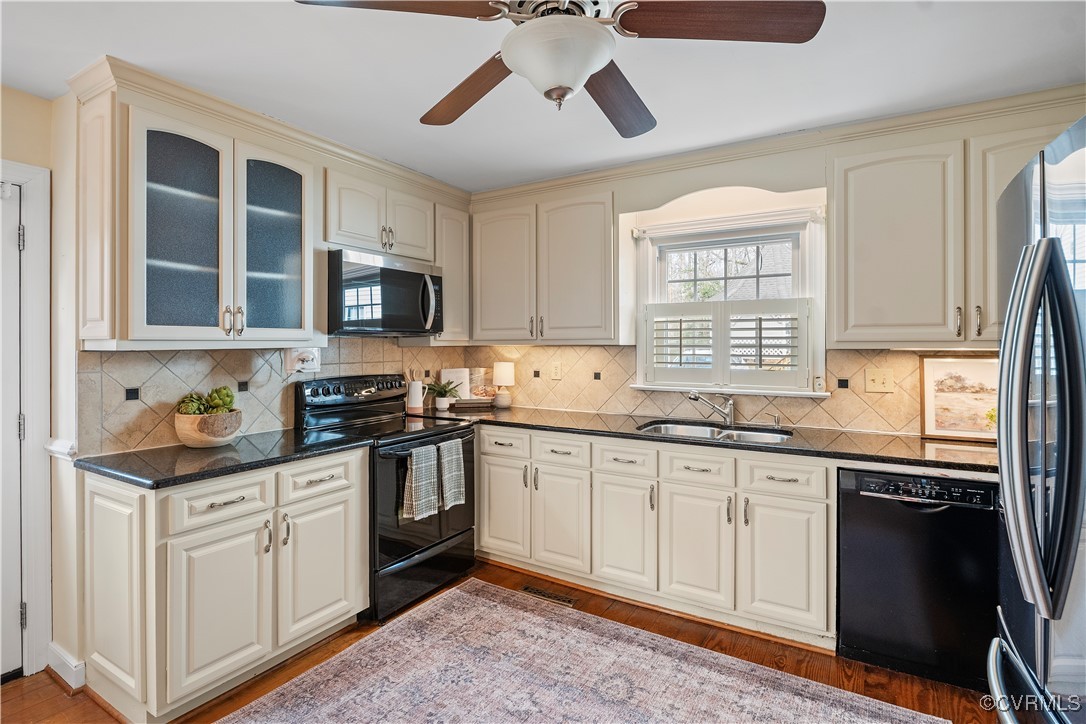 2208 Persimmon Trek Henrico, VA 23233 - Photo 14 of 44 a kitchen with stainless steel appliances granite countertop a stove sink and cabinets