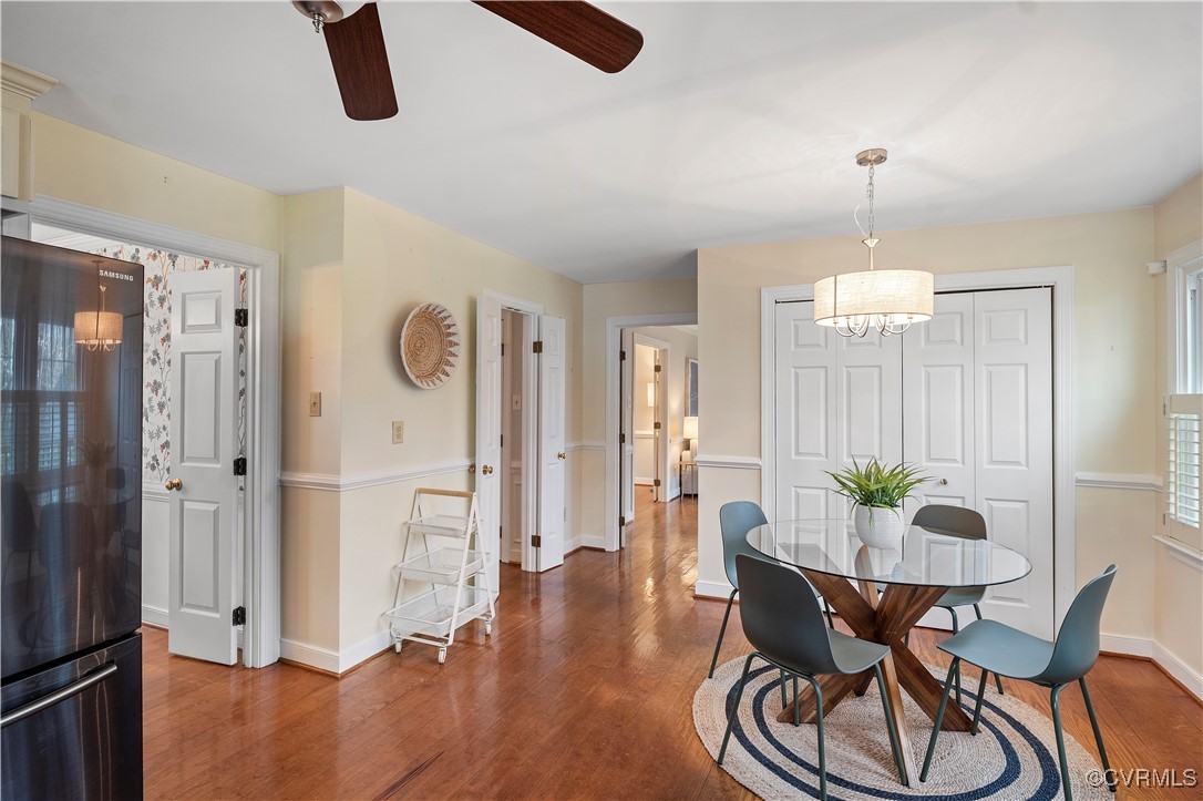 2208 Persimmon Trek Henrico, VA 23233 - Photo 15 of 44 a dining room with furniture a chandelier and wooden floor