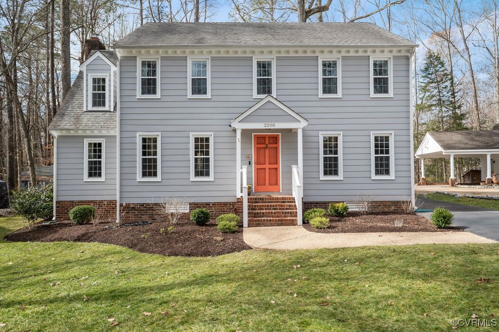 2208 Persimmon Trek Henrico, VA 23233 - Photo 2 of 44 a front view of a house with a yard and outdoor seating