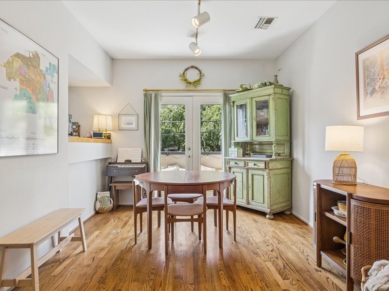 1369 Arlington Street, Unit 1369 Houston, TX 77008 - Photo 15 of 35 a view of a dining room with furniture window and wooden floor