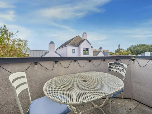 a view of a chairs and table in kitchen
