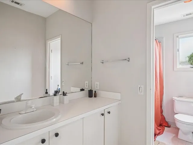 a bathroom with a sink and a toilet