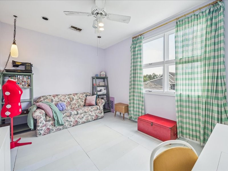 1369 Arlington Street, Unit 1369 Houston, TX 77008 - Photo 28 of 35 a bedroom with furniture and a large window