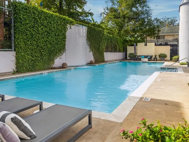 a view of a swimming pool with a patio