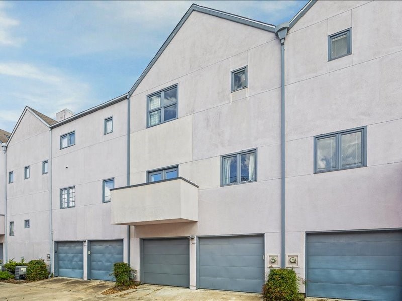 1369 Arlington Street, Unit 1369 Houston, TX 77008 - Photo 8 of 35 a front view of a building with large windows