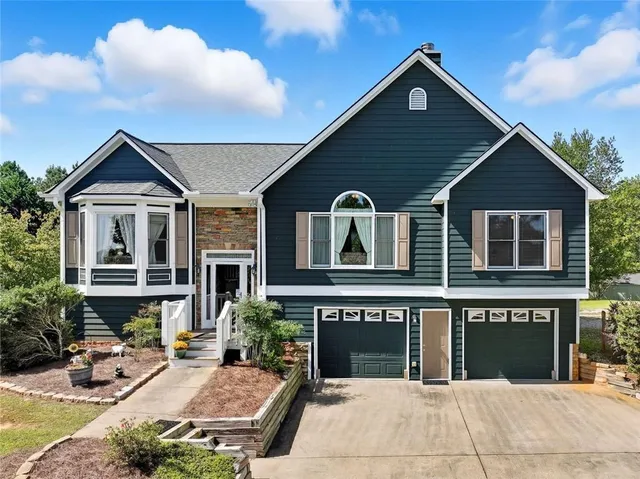 a front view of a house with yard