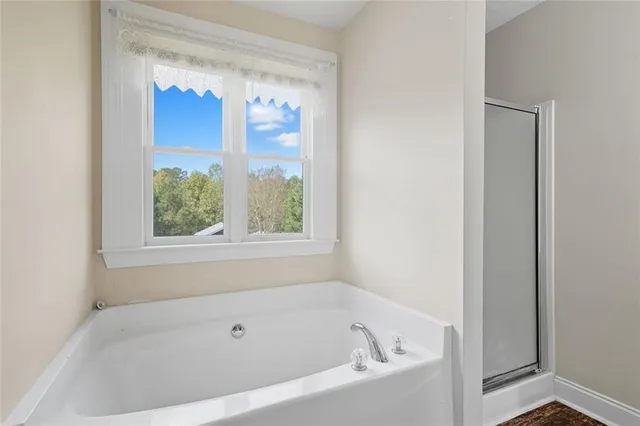 a white bath tub sitting next to a window