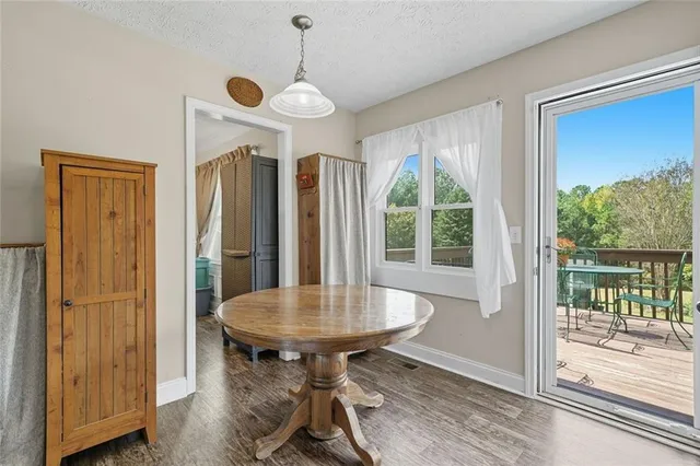 a view of a dining room with furniture window and outside view