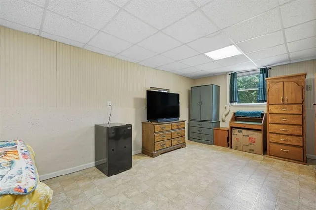a room with furniture and a flat screen tv