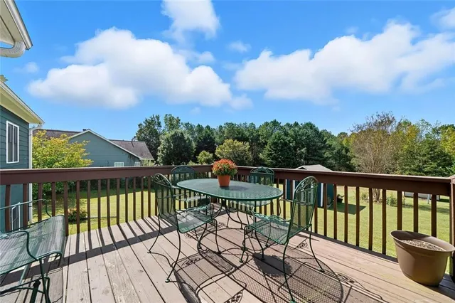 a view of a two chairs and table in the balcony