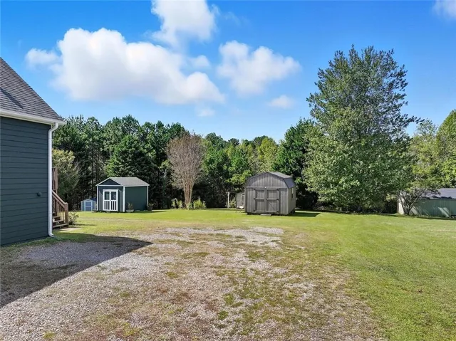 a view of a big yard with palm trees
