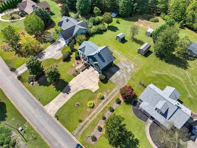 an aerial view of a house with outdoor space