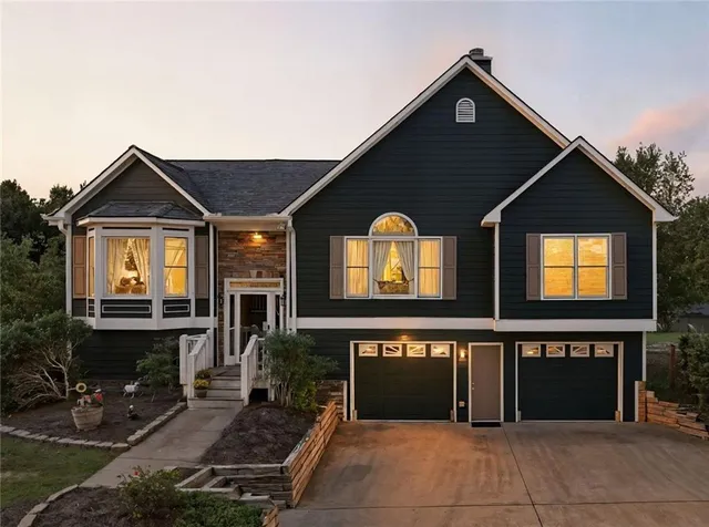a front view of a house with yard