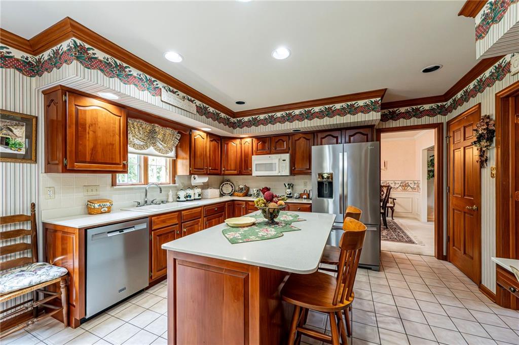 1118 Sandstone Road Greensburg, PA 15601 - Photo 12 of 50 a view of a kitchen filled with furniture and wooden floor