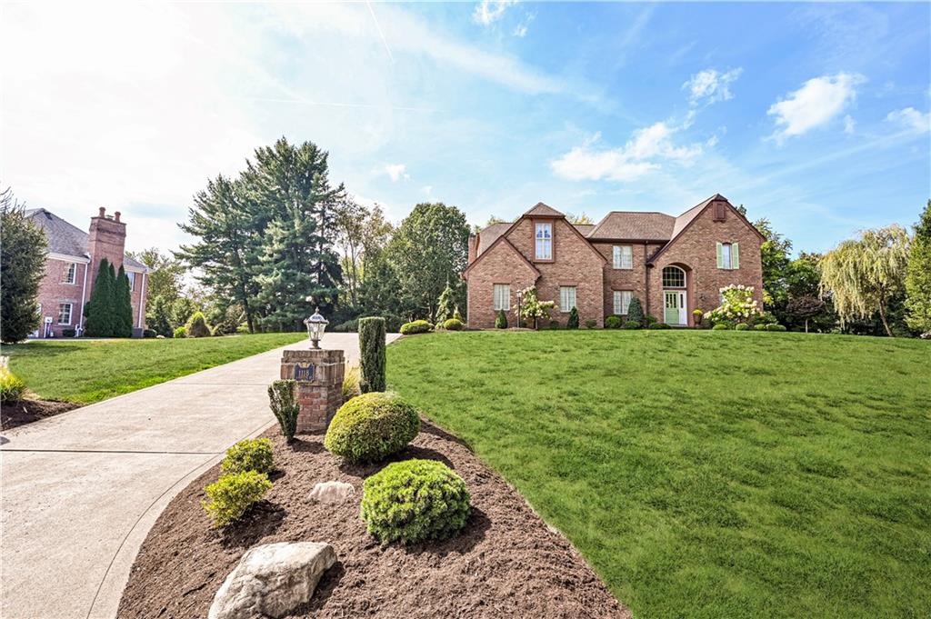 1118 Sandstone Road Greensburg, PA 15601 - Photo 2 of 50 a front view of a house with a yard and garage