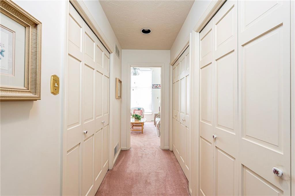 1118 Sandstone Road Greensburg, PA 15601 - Photo 25 of 50 a view of a hallway with wooden floor and staircase