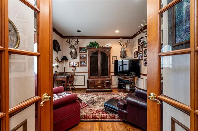 a view of a dining room with furniture and chandelier