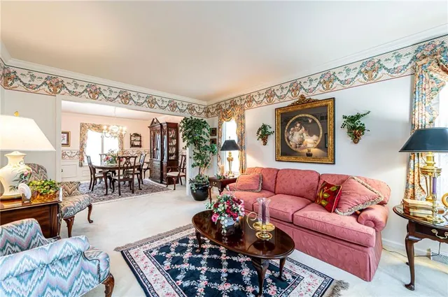 a dining hall with stainless steel appliances granite countertop a stove and a sink