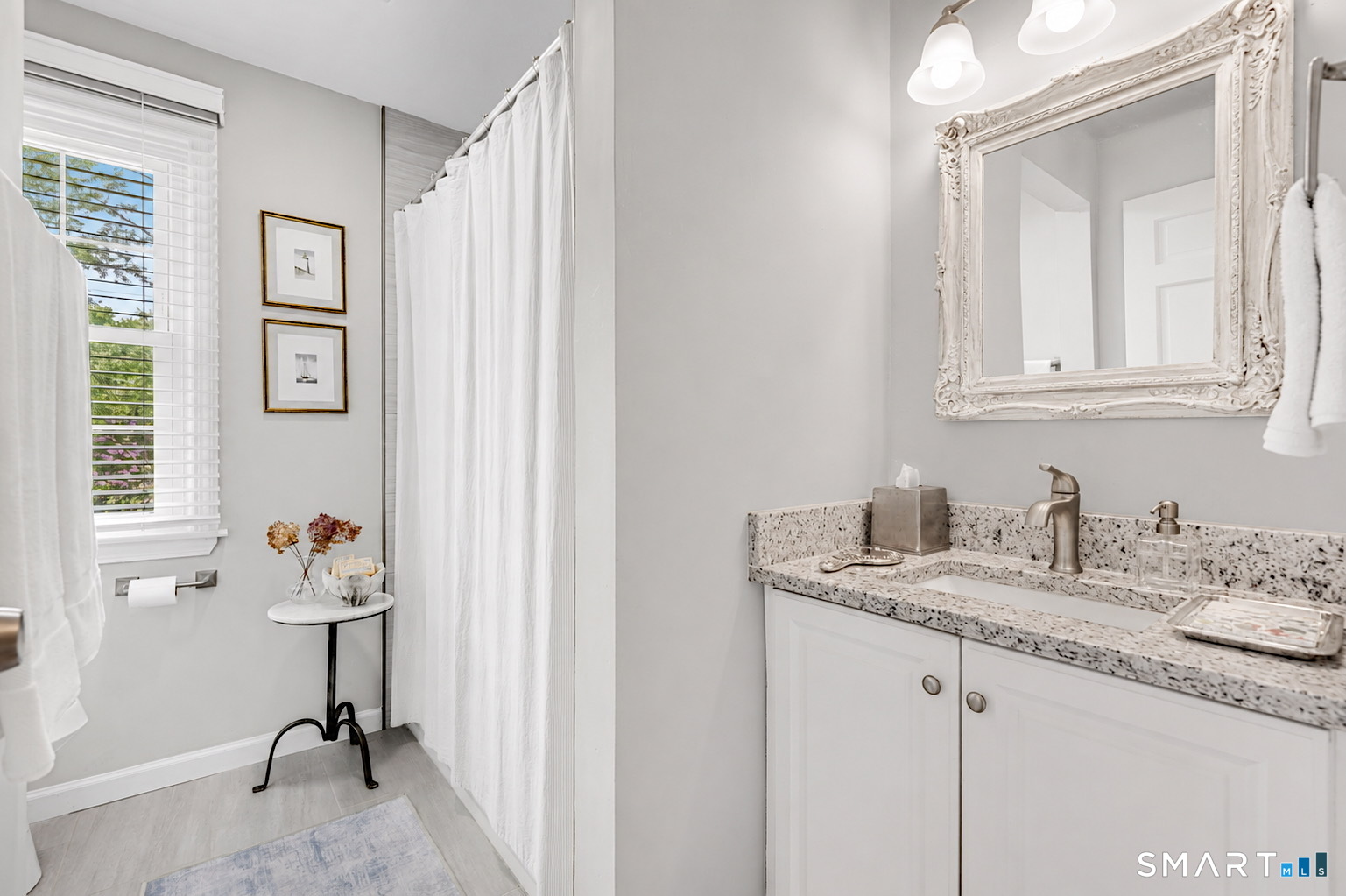 1000 Bassett Road Watertown, CT 06795 - Photo 16 of 35 a en suite bathroom with a granite countertop sink and a mirror