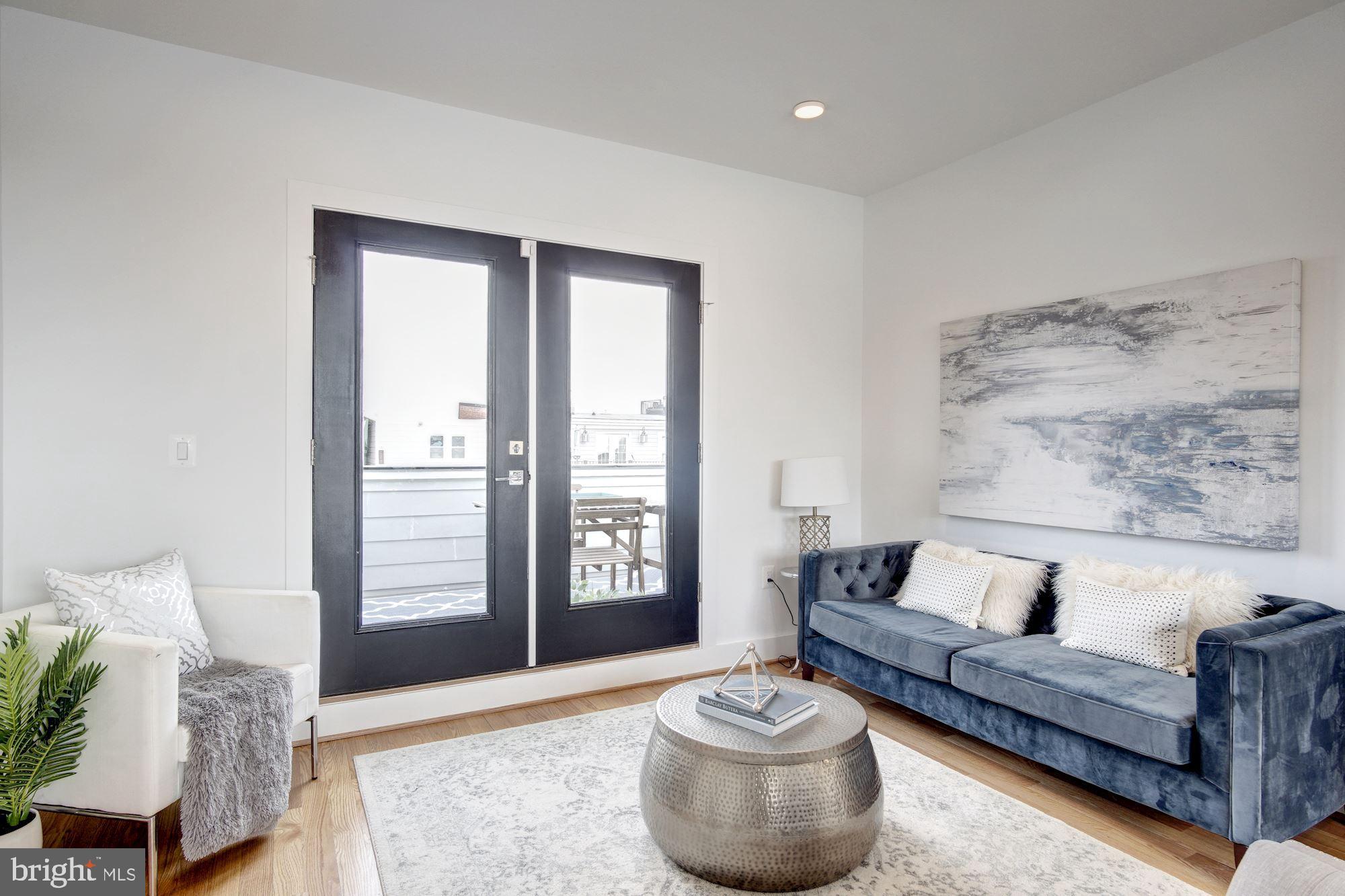 609 Gresham Place Northwest, Unit 2 Washington, DC 20001 - Photo 4 of 20 living room leads to both private outdoor spaces